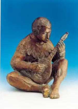 Gitaarspeler zittend bronzen beeld